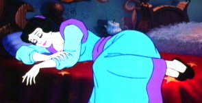 Snow White sleeps on a familiar small bed.